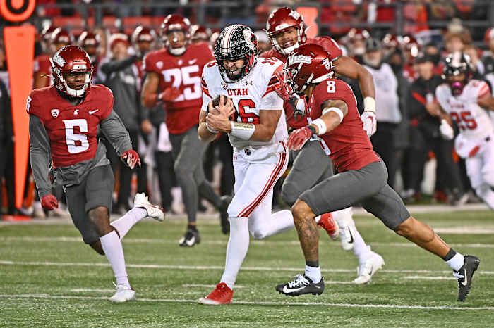 Utah Utes quarterback Bryson Barnes (16) moves the ball against Washington State Cougars defensive back Chau Smith-Wade (6) and defensive back Armani Marsh (8) in the second half at Gesa Field at Mart.